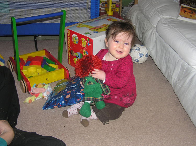 Ivy opens her presents Christmas 2007